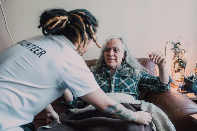 hospice volunteer helping a patient