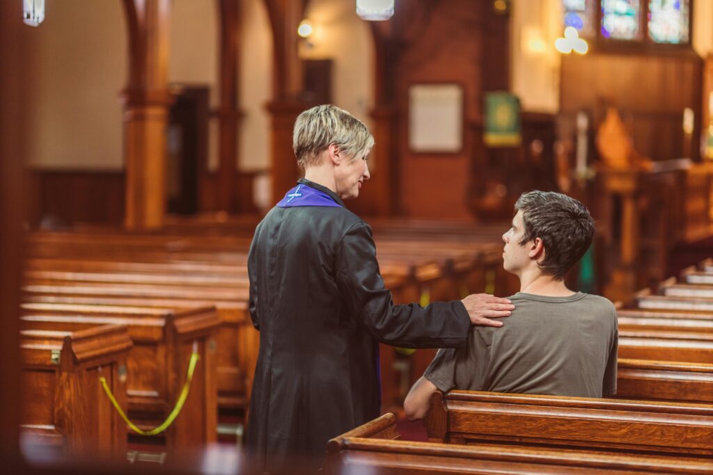 chaplain comforting a hospice patient