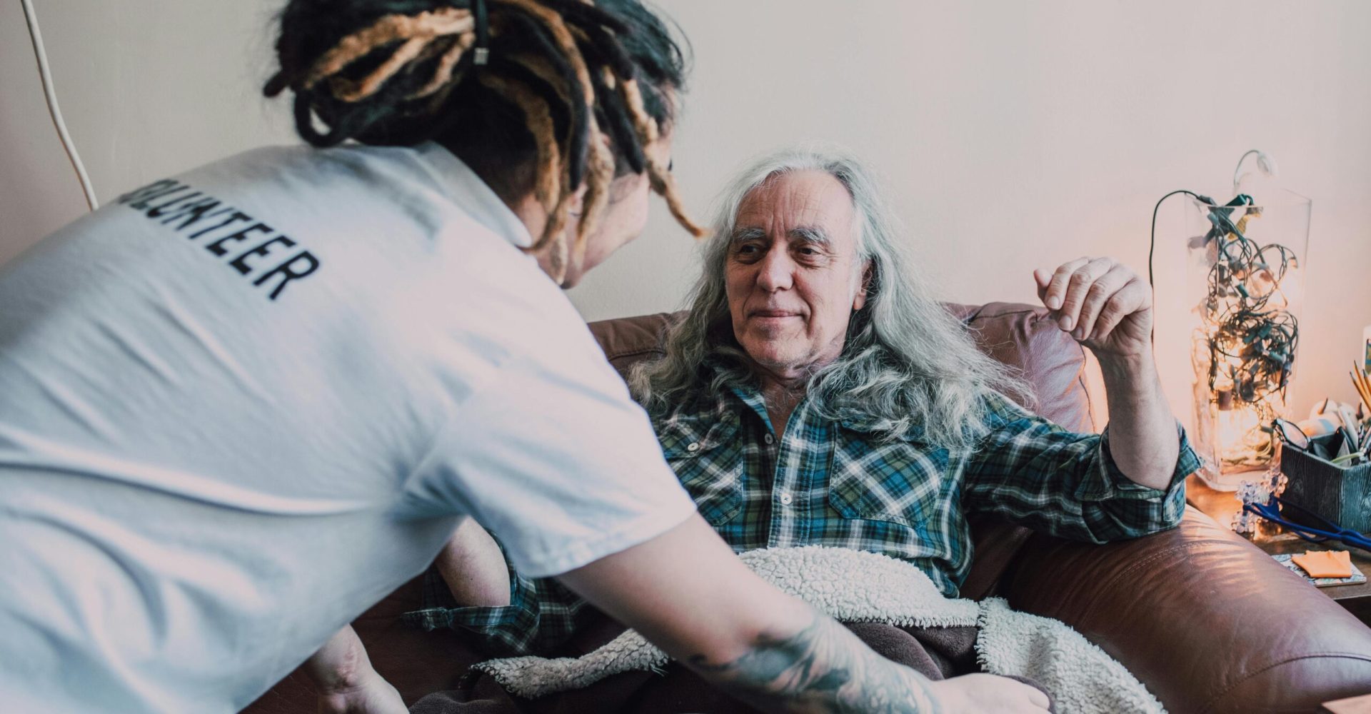 hospice volunteer helping a patient
